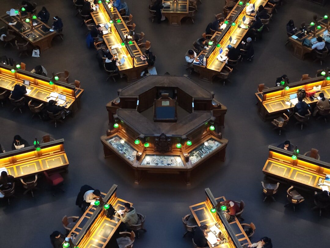 Modern newsroom with journalists working at desks
