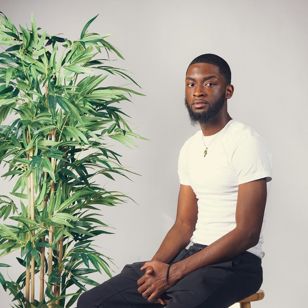 Person meditating calmly in a serene indoor space