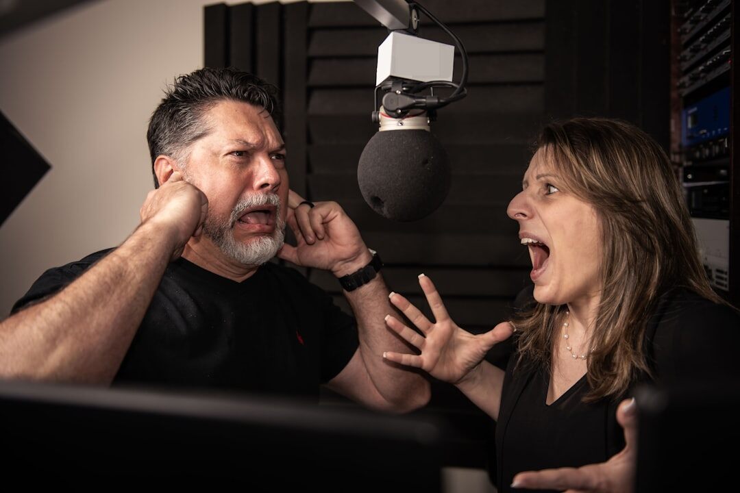 Journalist practising voice delivery techniques with a coach