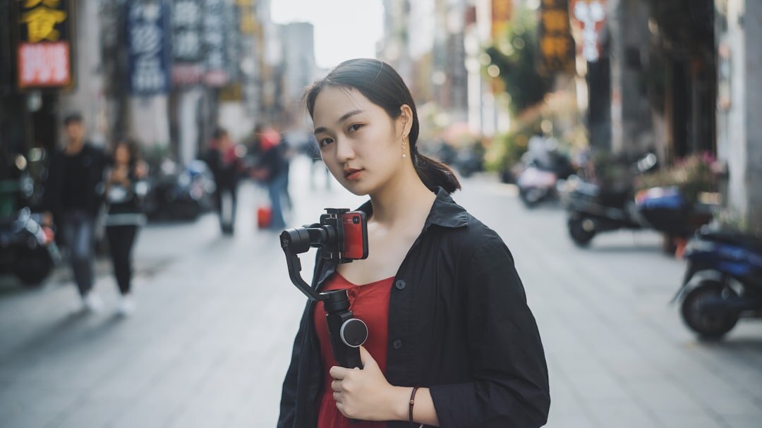 Reporter doing a live broadcast outdoors in a city