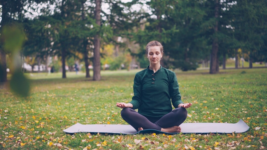 Close-up of a person practising deep breathing outdoors